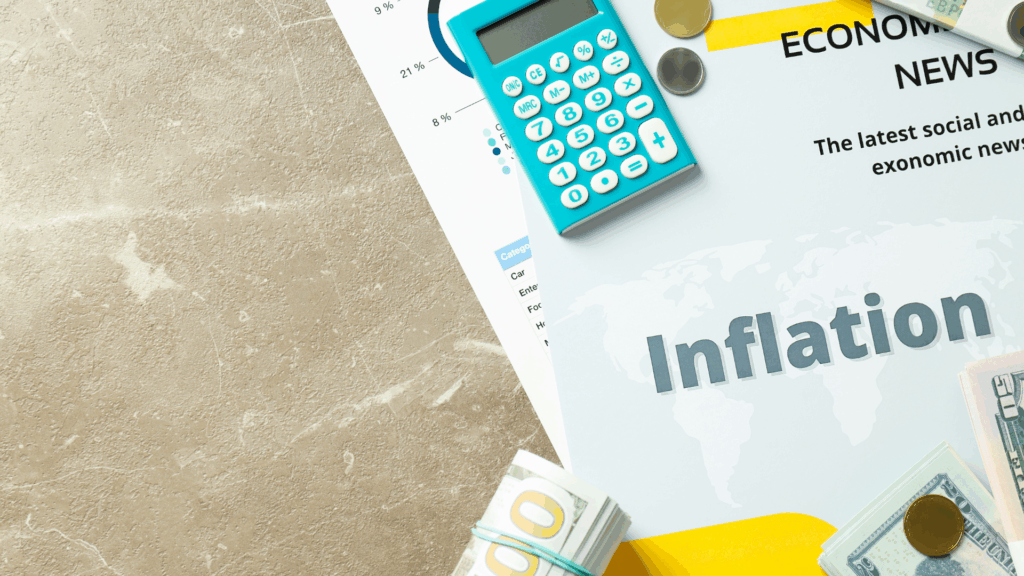 A report titled Inflation lies on a desk with a blue calculator, coins, banknotes, and another paper labeled Economic News. A faint world map appears on the report, symbolizing global financial topics.