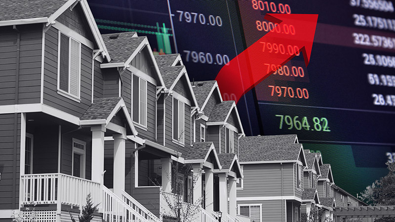 A row of modern suburban houses with a large red arrow pointing upward overlaid on stock market numbers, symbolizing rising housing prices or a booming real estate market.
