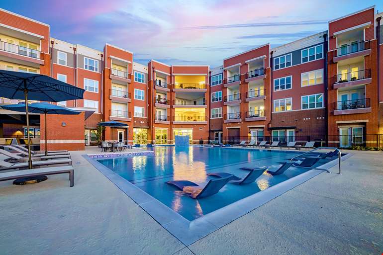 Visual showing a luxury multifamily apartment property with a pool, representing multifamily investment strategies for accredited investors.