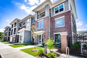BAM Capital guide on multifamily acquisition criteria, shown with a modern Class A apartment property at Hayden Flats in Bloomington, Indiana.