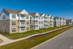 Cover image for a BAM Capital guide on diversified portfolio construction hedge fund strategies, featuring an apartment community photo.