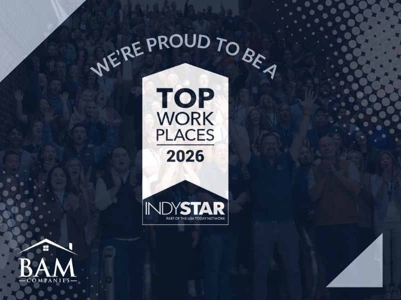 Crowd at a Top Work Places 2026 awards banner, with a central badge reading 'Top Work Places 2026' and INDYSTAR/BAM logos.